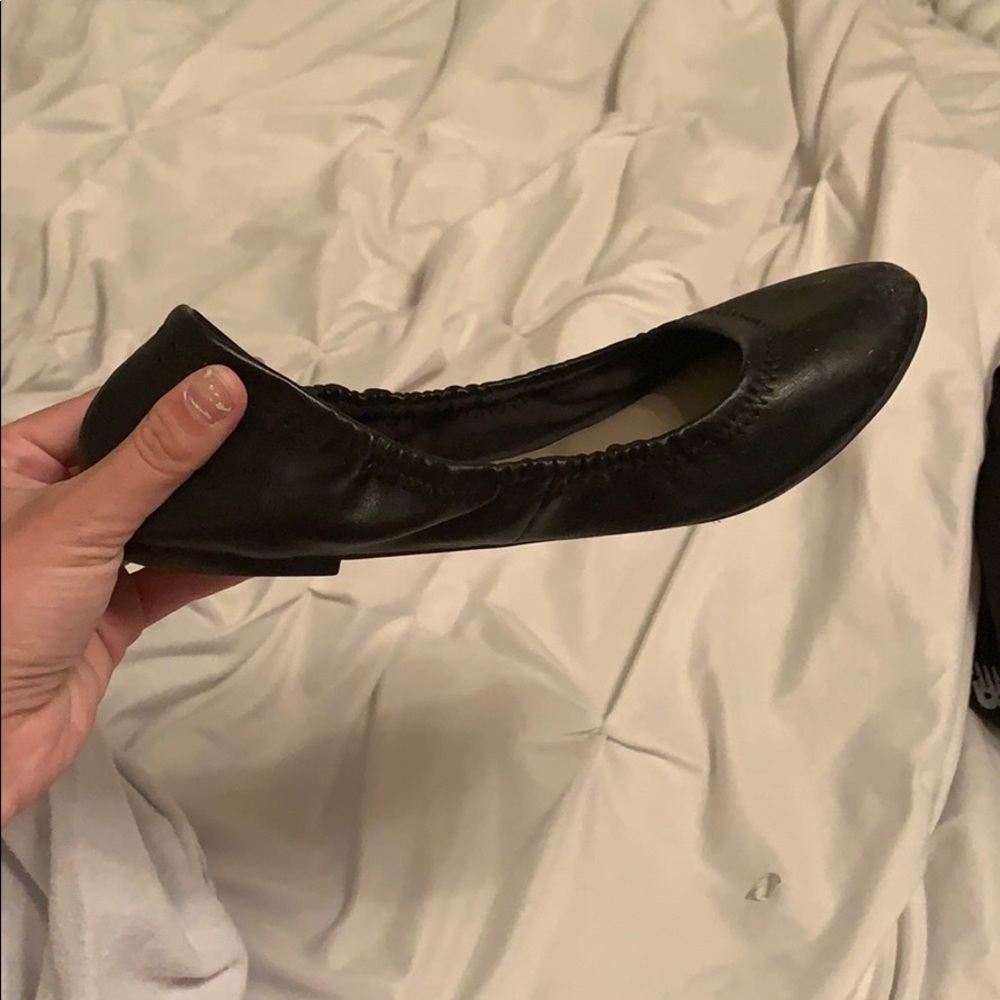 worn black flats